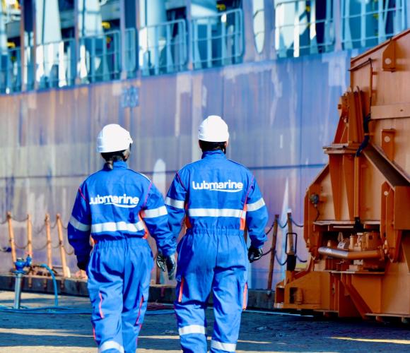 Marine Lubricant Engineer walking in a shipyard