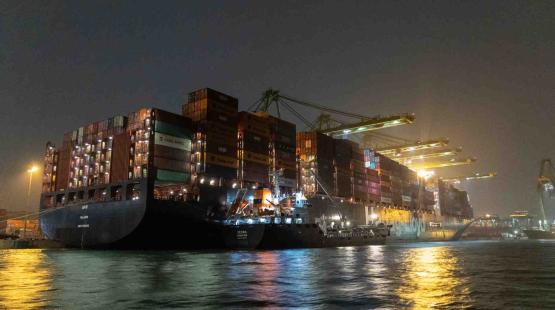 ©TotalEnergies Marine Fuels Bunkering barge operating in Singapore alongside Hapag-Lloyd containership