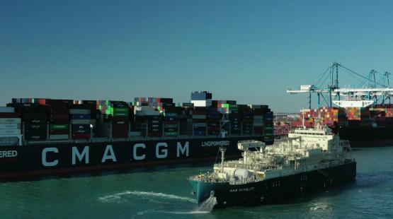 ©TotalEnergies Gas Vitality Bunkering Barge in the Port of Marseille Fos next to a CMA CGM ship