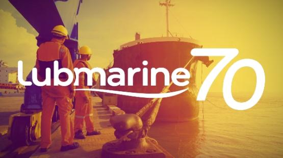 ©TotalEnergies Lubmarine 70th anniversary logo with a cargo vessel at berth behind