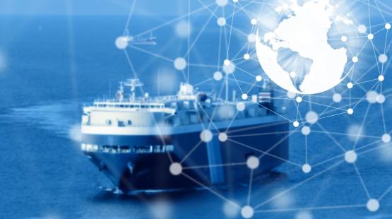 (c)TotalEnergies, AdobeStock A RoRo ship at sea with a blue filter and a world map icone